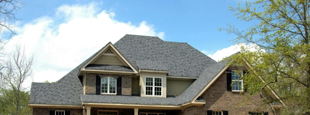 Roof of a house with dark asphalt shingles