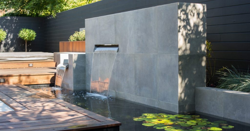 A modern outdoor water feature in a newly renovated home.