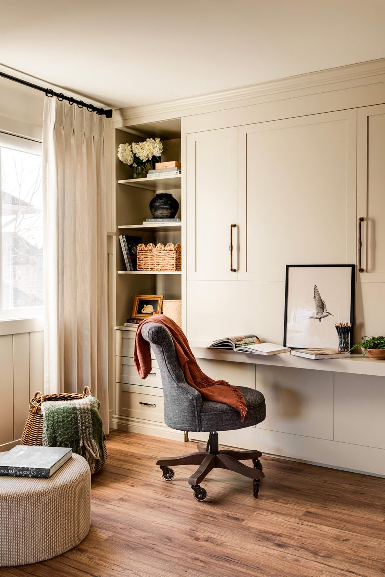 An office with high built-in cupboards.