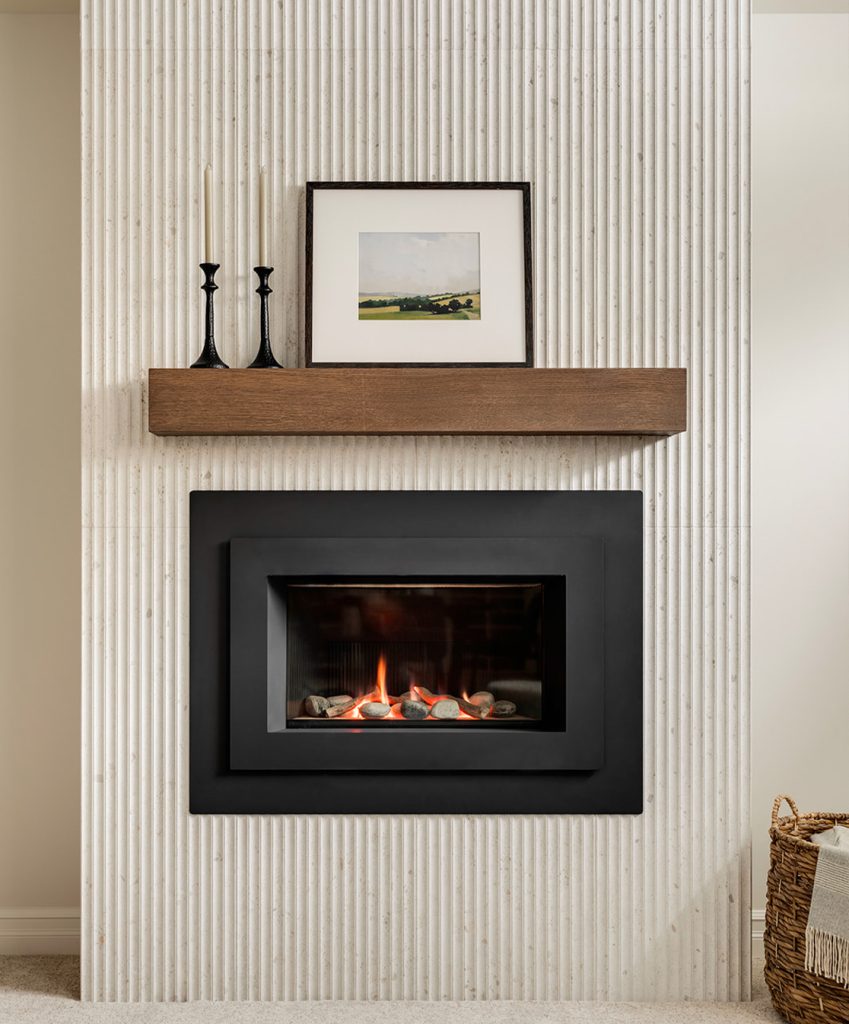 A fluted fireplace in a newly renovated basement.